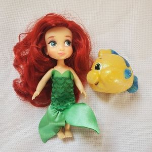 Ariel and flounder mini dolls.